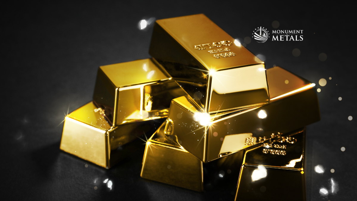 Stack of ultra-realistic gold bullion bars with bright reflective highlights on a dark background, featuring the Monument Metals logo in the upper right, emphasizing wealth, value, and physical gold investment.