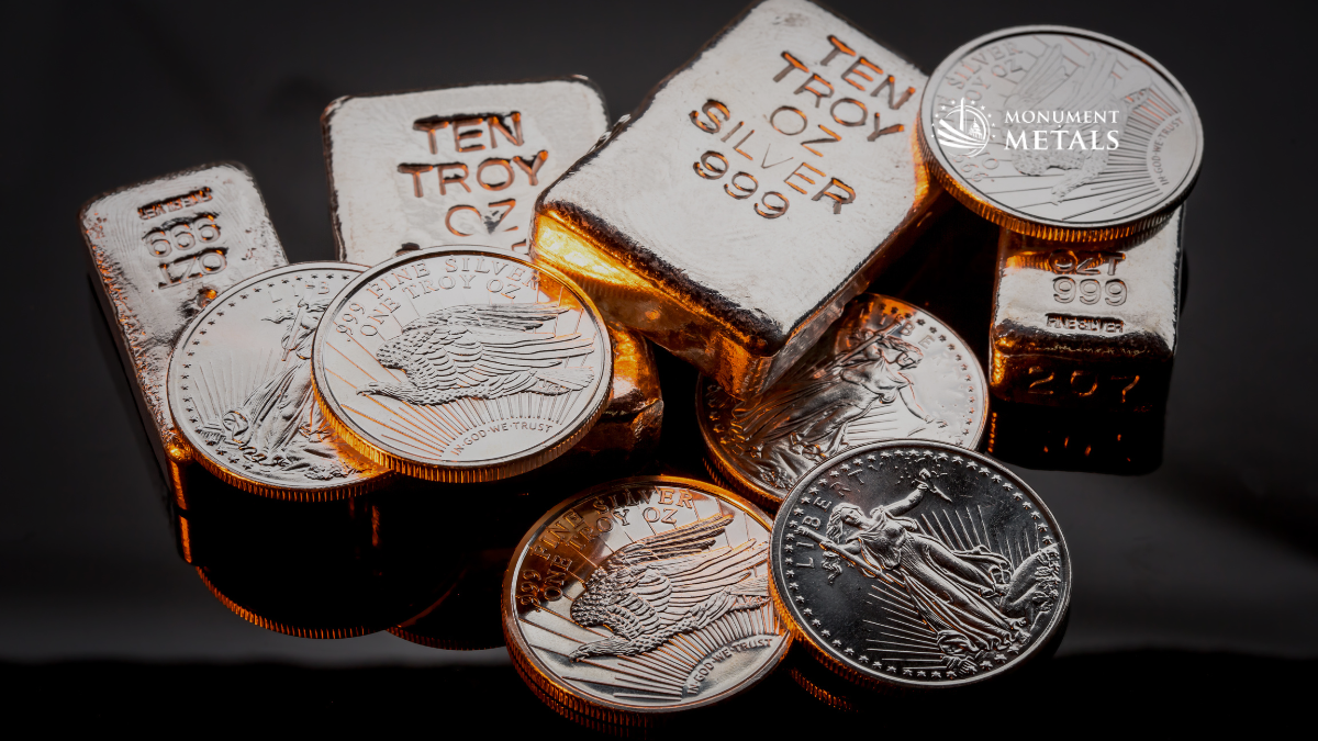 Close-up of .999 fine silver bullion bars and American Silver Eagle coins arranged together, illuminated with warm lighting against a dark background.